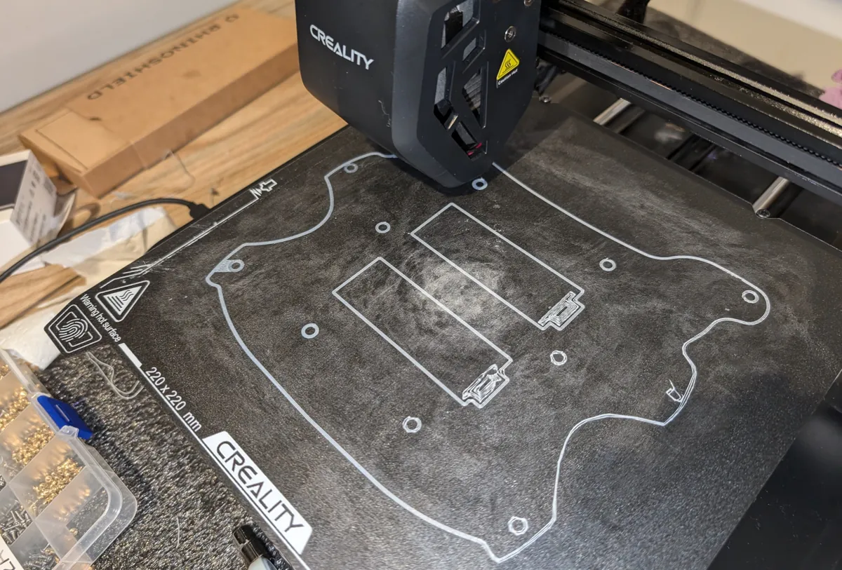 Steering wheel outline being printed on a Creality 3D printer bed